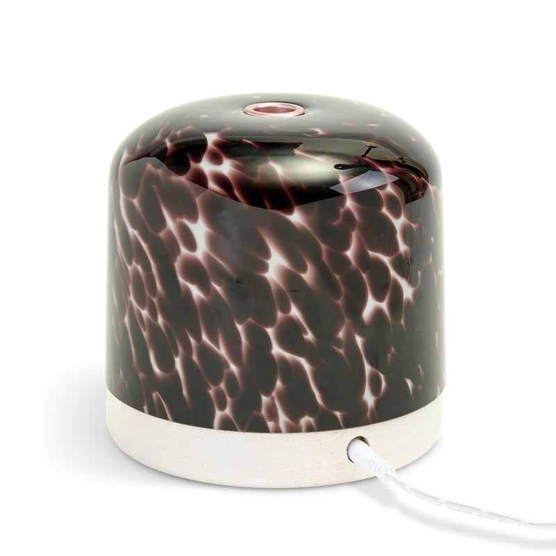 NEOM Tortoiseshell diffuser on a white background