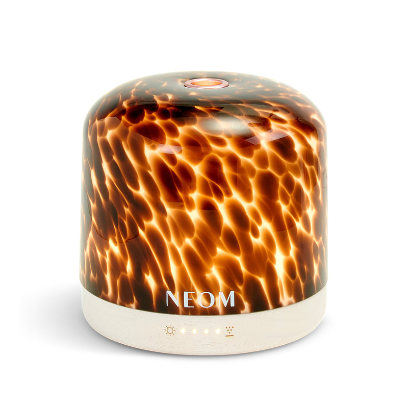 NEOM diffuser with tortoiseshell pattern on a white background