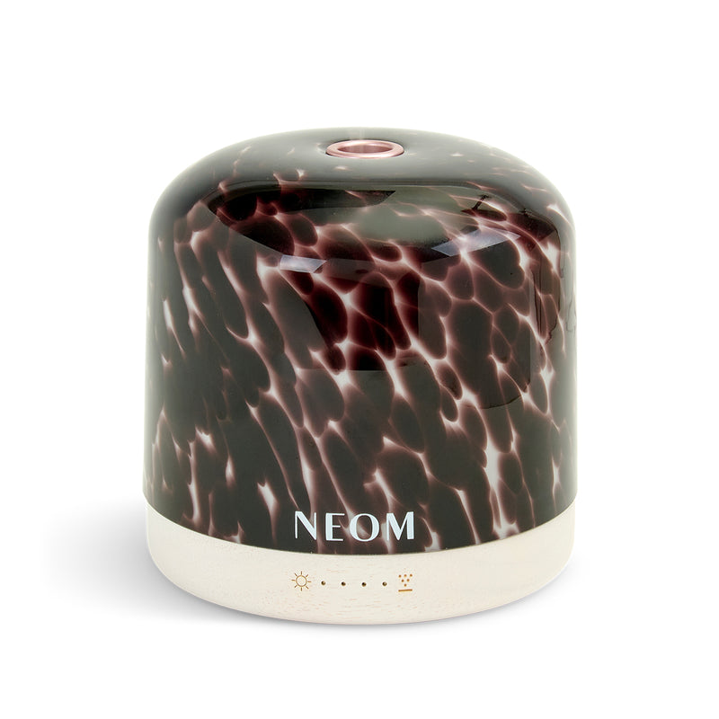Tortoiseshell diffuser product with 'NEOM' branding on a white background