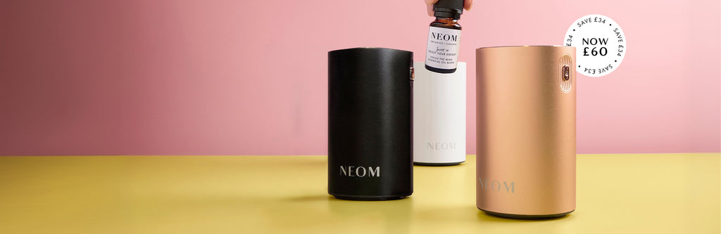 NEOM Pod Mini+ in black, rose gold and white with a focus the mind essential oil blend