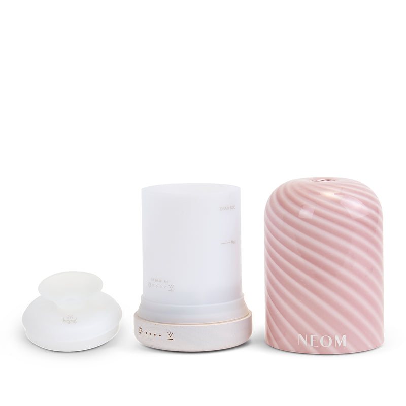 NEOM raspberry ripple essential oil diffuser on a white background