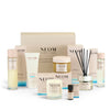 NEOM Real Luxury Black Friday box with skincare and home fragrance products on a white background