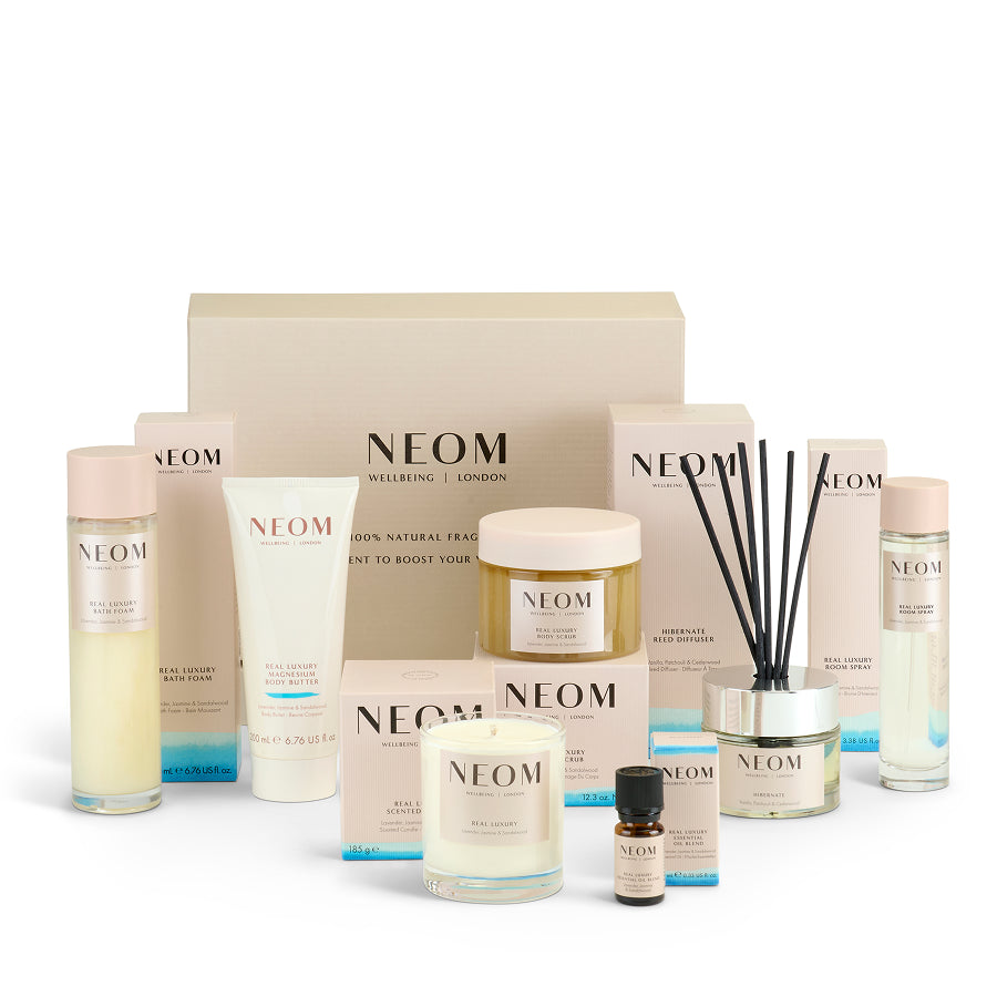 NEOM Real Luxury Black Friday box with skincare and home fragrance products on a white background
