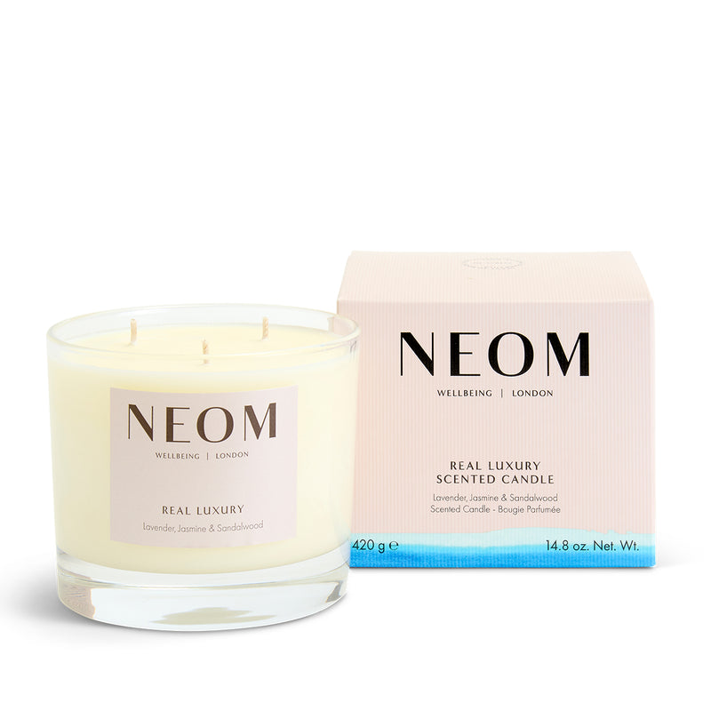 NEOM scented candle and packaging on a white background