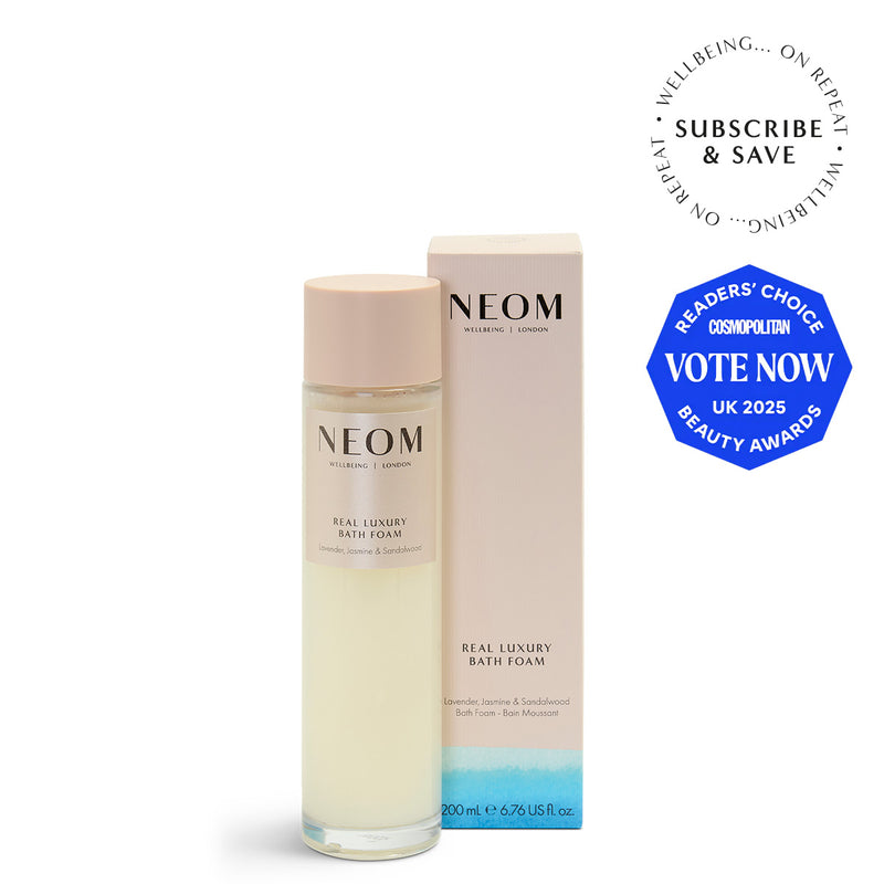NEOM Real Luxury Bath Foam bottle and packaging on a white background with an award badge.
