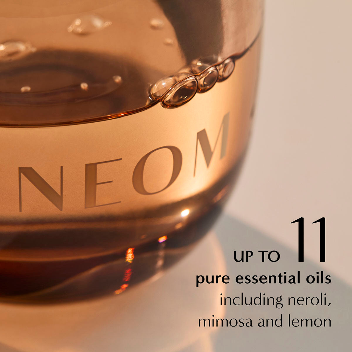 NEOM diffuser oil close-up highlighting 11 essential oils including neroli, mimosa and lemon