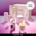 NEOM bath and body and wellness products on a pink background. Save 41%.