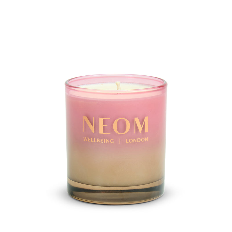 NEOM Sparkling Joy 1 Wick Scented Candle with a pink and beige gradient on a white background