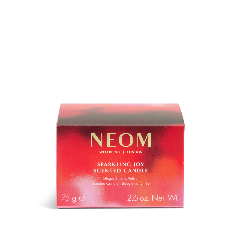 NEOM Sparkling Joy Travel Scented Candle packaging on a white background