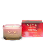 NEOM Sparkling Joy Travel Scented Candle with packaging on a white background