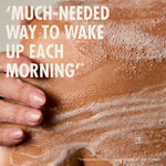 “Close-up of a person’s shoulder covered in foam with a hand touching the skin. Large text reads: ‘Much-needed way to wake up each morning.’ Small print: ‘*Independent blind study on 83 people after 2 weeks.’”