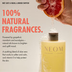 “NEOM Squeeze the Day Body Wash with foam as a grapefruit is squeezed above it. Text reads: ‘Not just a wash, a mood switch! 100% natural fragrances.’ Additional text: ‘Powered by grapefruit, mandarin and eucalyptus – natural oils known to brighten and uplift mood. A soothing blend of aloe vera that works to soften and calm, and vitamin E to help protect the skin.’”