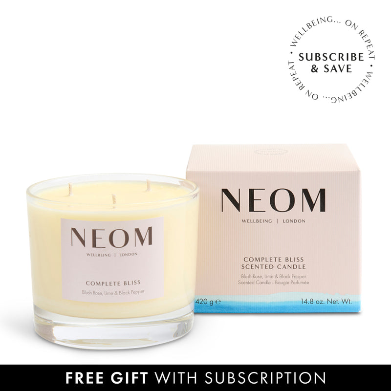 NEOM Complete Bliss scented candle and packaging on a white background