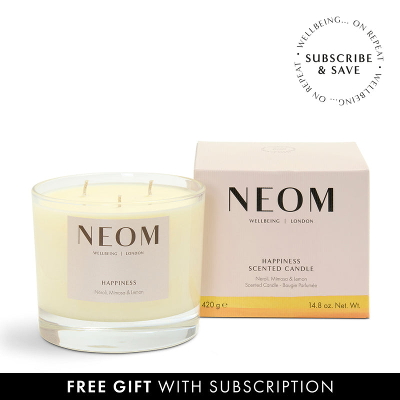 NEOM Happiness scented candle with packaging on a white background