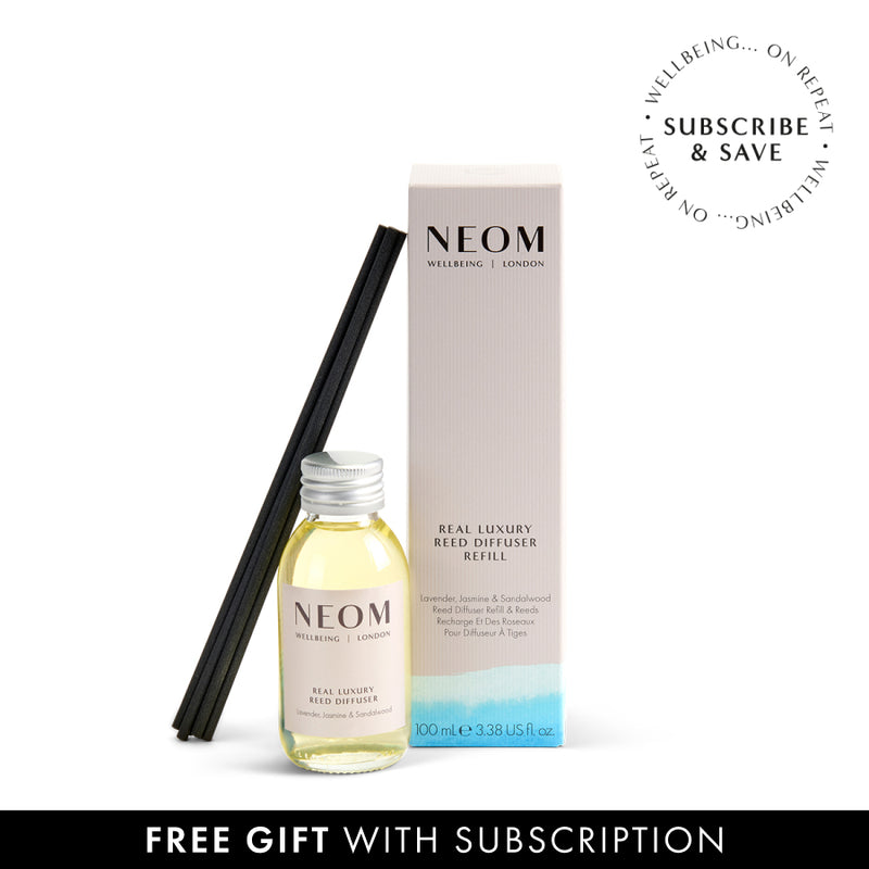 NEOM Real Luxury reed diffuser refill bottle and packaging on a white background