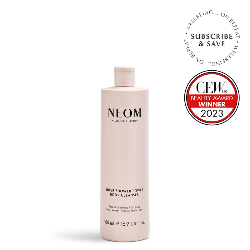 NEOM body cleanser bottle with CEW Beauty Award Winner badge on a white background