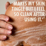 “Close-up of a person’s shoulder covered in soapy lather with a hand resting on the skin. Large text reads: ‘Makes my skin tingle but I feel so clean after using it.’ Small print: ‘*Based on customer reviews on www.neomwellbeing.com.’