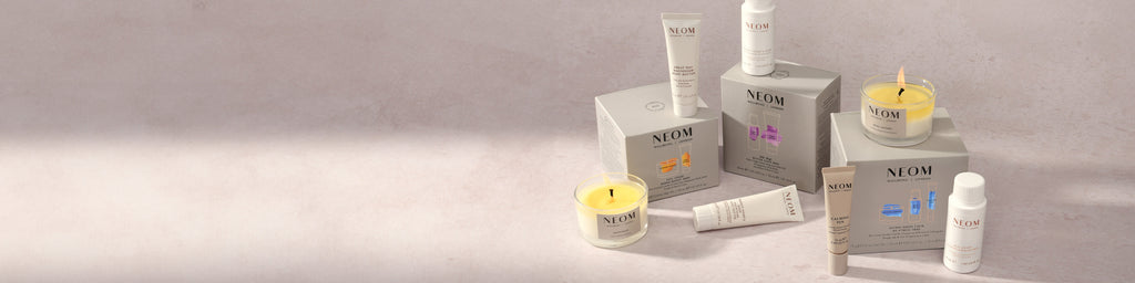 NEOM collection of bundles on a pink background