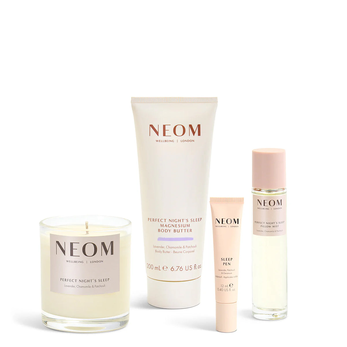 NEOM skincare products including a candle, tube, and bottles on a white background