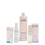 Collection of NEOM skincare products on a white background
