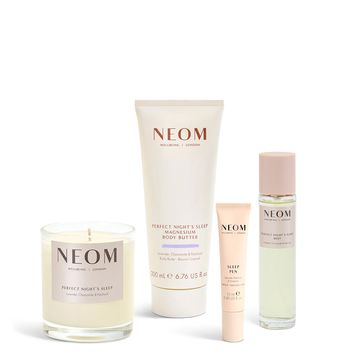 NEOM product set including a candle, body butter, sleep pen, and sleep mist on a white background