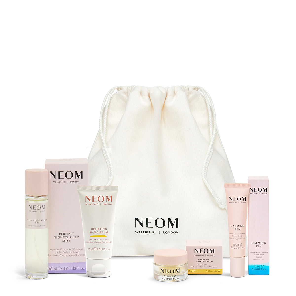 NEOM skincare products with a white drawstring bag on a white background