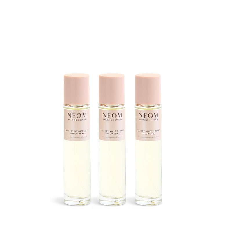 3 NEOM pillow mist bottles on a white background