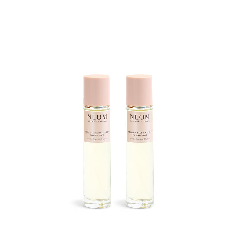 Two NEOM pillow mist bottles on a white background
