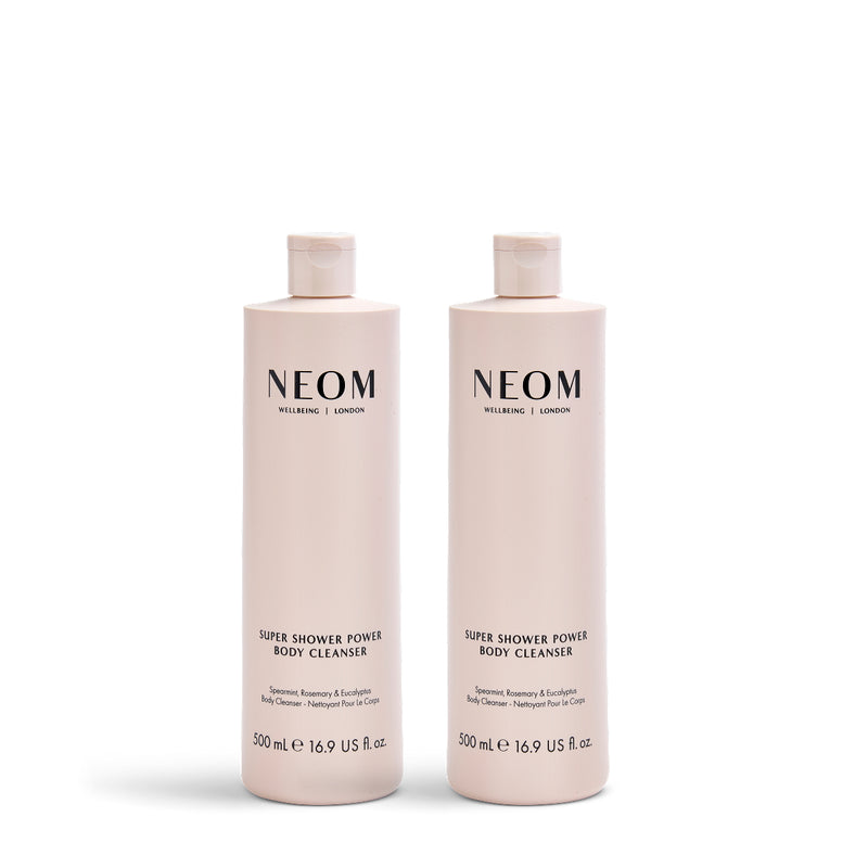 Two NEOM Super Shower Power Body Cleaners on a white background
