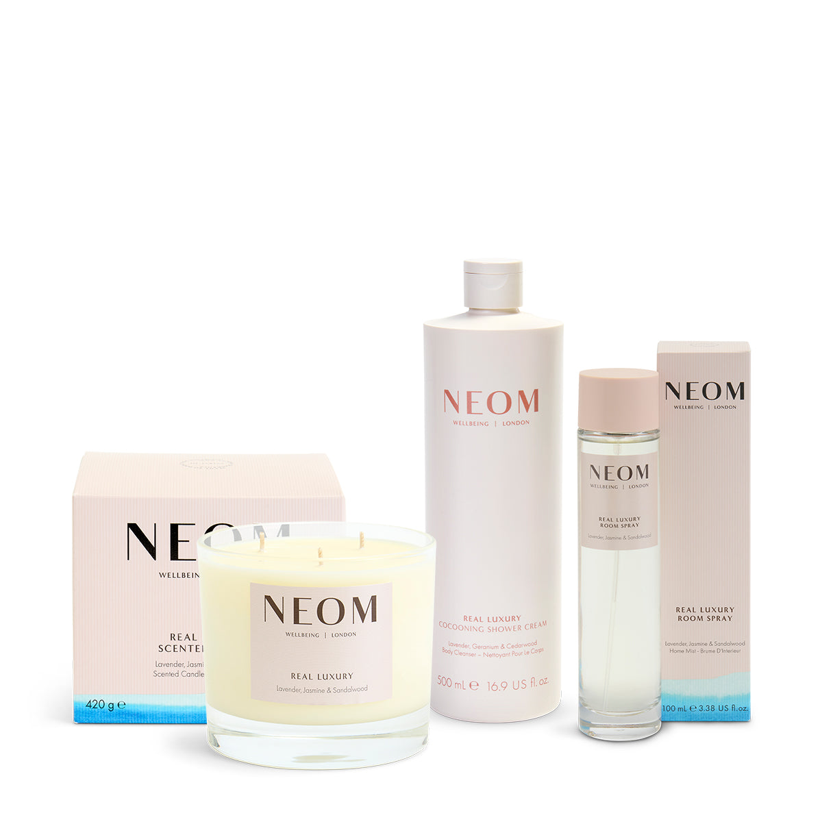 NEOM product lineup including candles and bottles on a white background