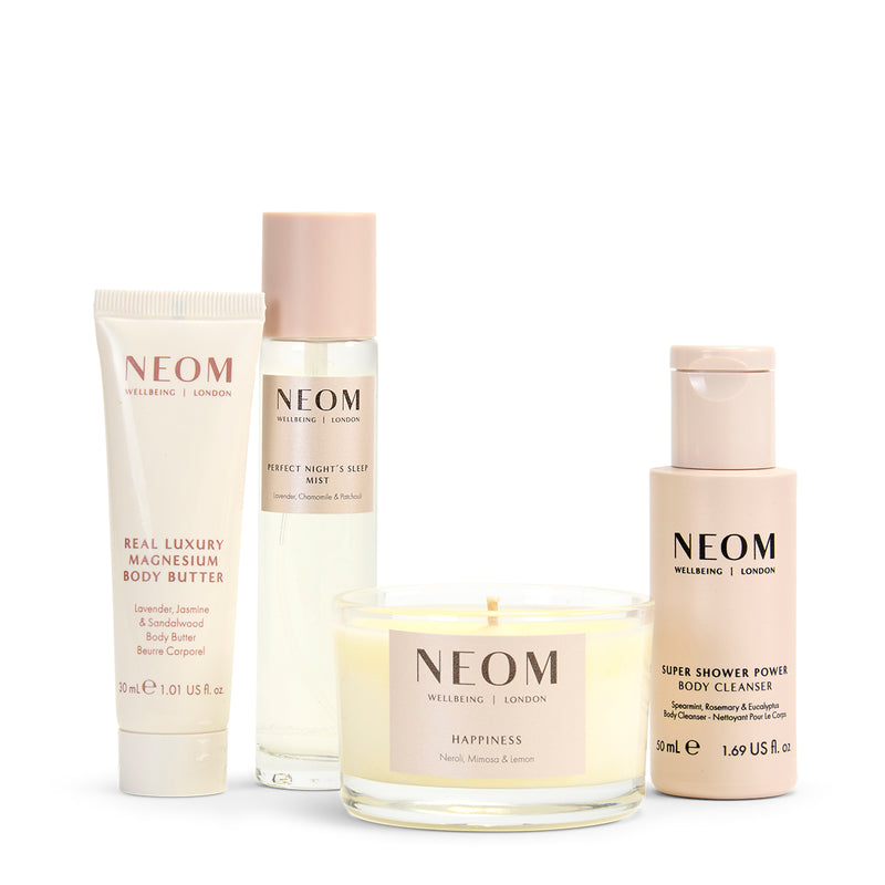 NEOM bath and body and wellness products on a white background
