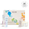 NEOM wellness gift set with various products on a white background with a Perfect Gift roundel with a present