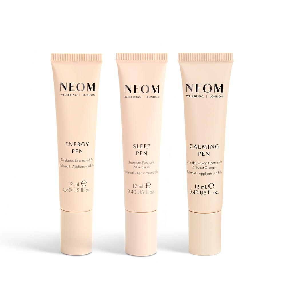 Three NEOM pens on a white background