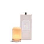 NEOM diffuser with packaging on a white background