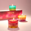 NEOM travel candles with a pink box in the background