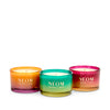 Three NEOM Christmas candles with gradient colours on a white background
