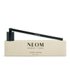 NEOM Candle Snuffer and packaging on a white background