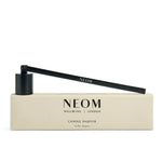 NEOM Candle Snuffer and packaging on a white background