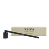 NEOM Candle Snuffer and packaging on a white background