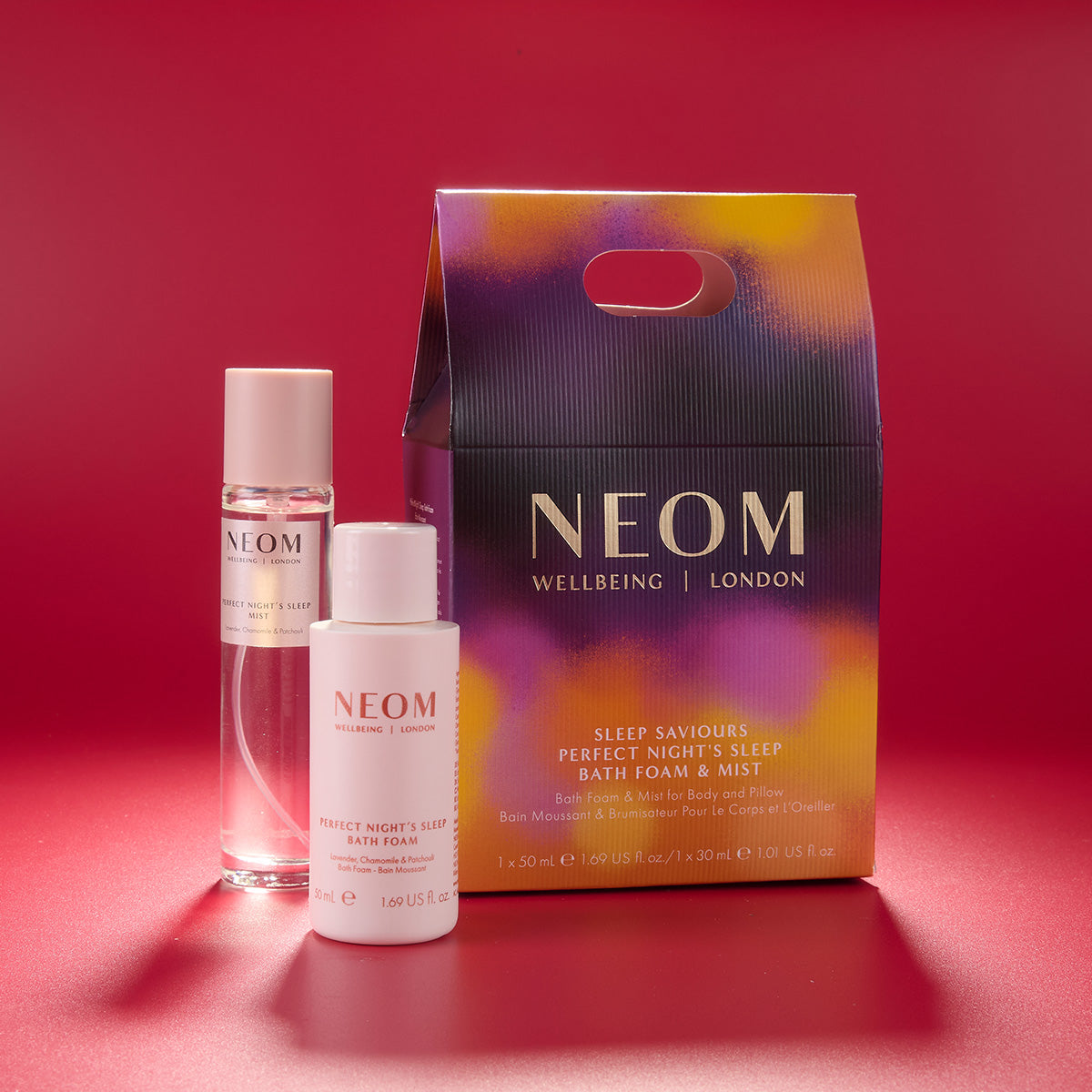 NEOM skincare products on a red background