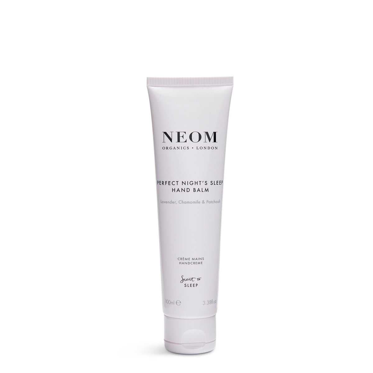 A tube of NEOM Perfect Night's Sleep Hand Balm with a white background. The packaging is primarily white with black and green text, describing the product as a 'rich night's sleep' hand balm'.